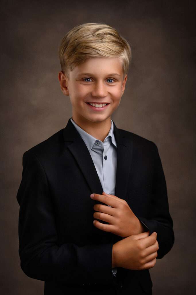 studio portrait of a boy smiling by san diego family photographer