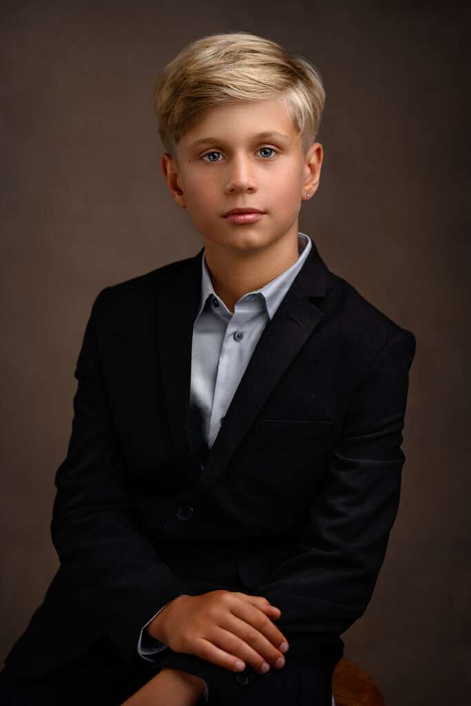 fine art studio portrait of a boy wearing black suite by san diego family photographer