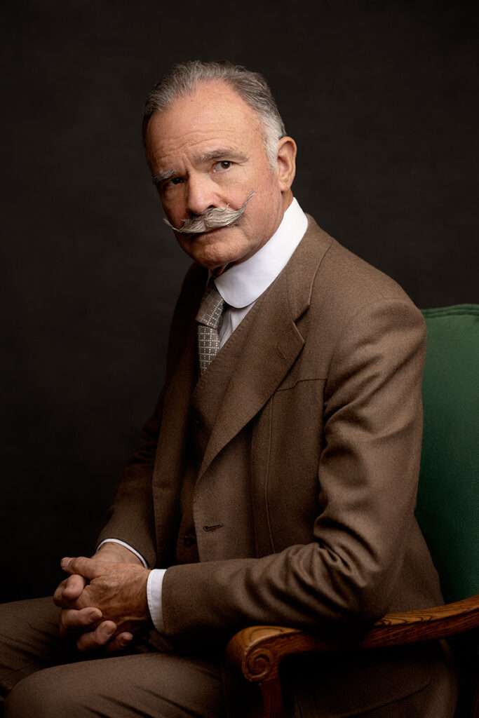 vintage portrait of men with mustage wearing brown suit by san diego headshots