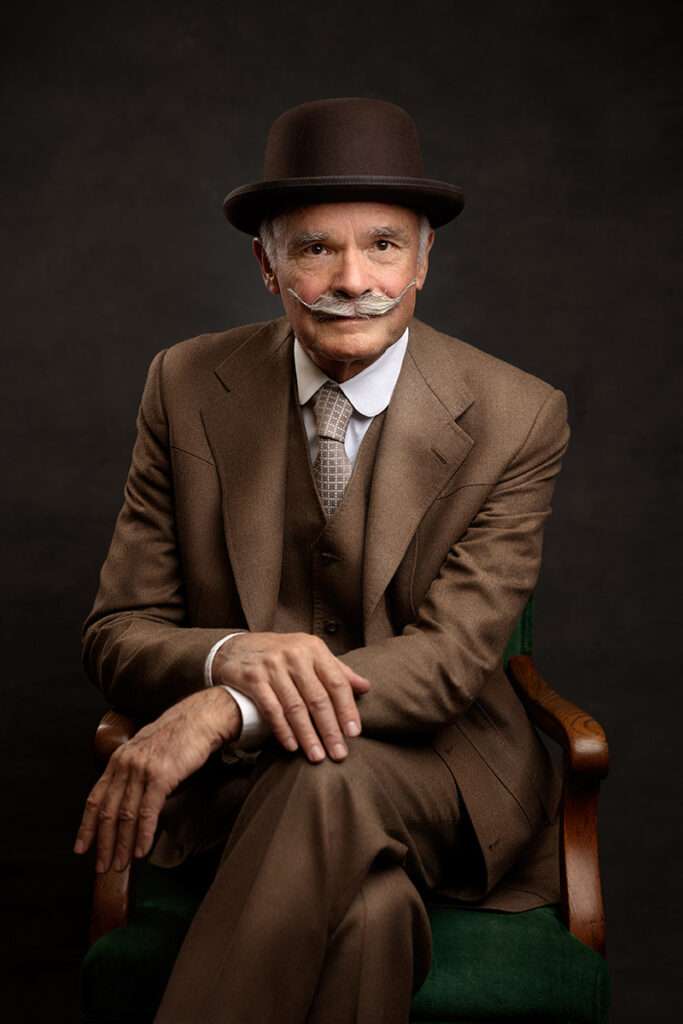 professional portrait of men wearing brown suit and black hat by san diego headshot photographer