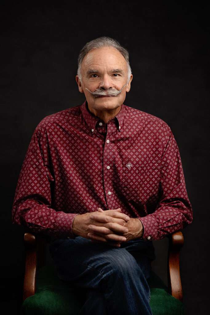 studio portrait of men in burgundy shirt by san diego headshot photographer