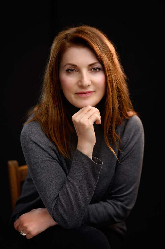 professional headshot of a woman in grey sweater by san diego headshots