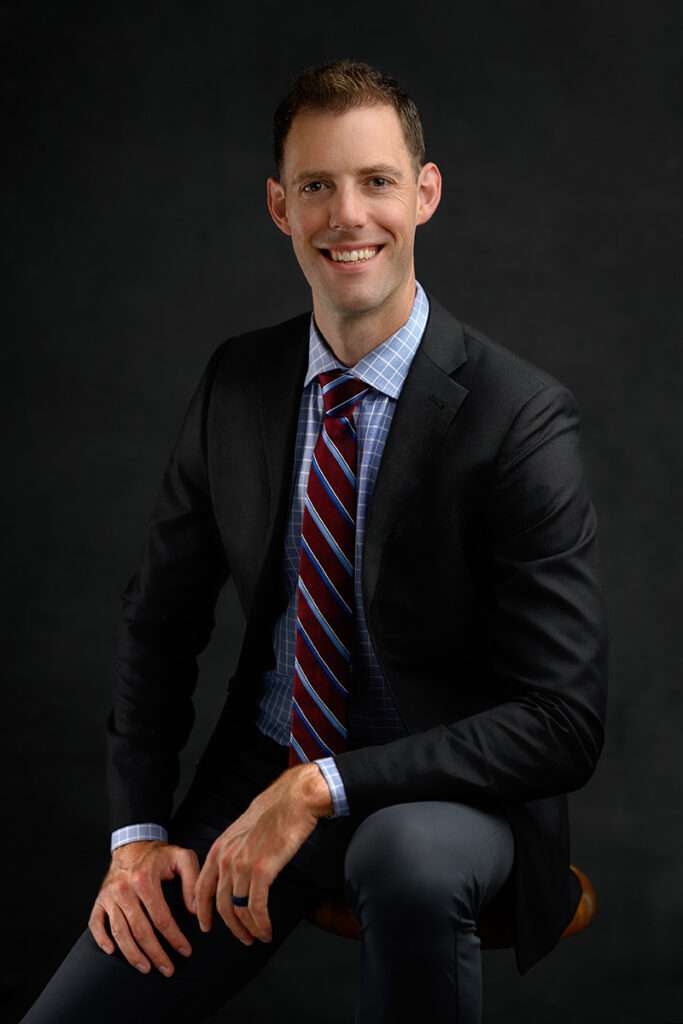 professional headshot of a man wearing suit and tie by professional headshot photographer in san diego